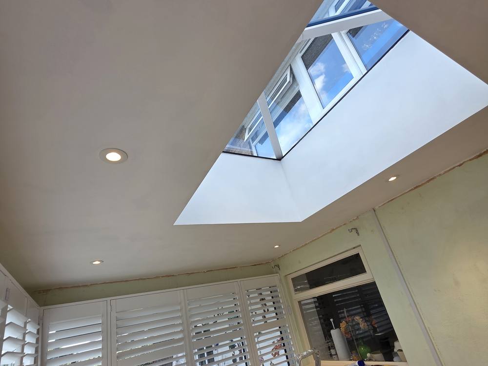 Recessed LED ceiling spotlights installed by NSS Electrics in a bright living room
